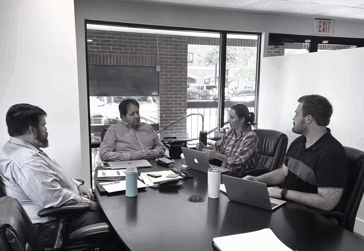 The Pocket Aces team in a strategy meeting